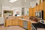The upgraded kitchen has high-end appliances and upgraded kitchen amenities 
